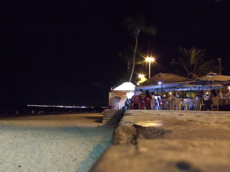 The beach and bars in Itapua by night, Brazil