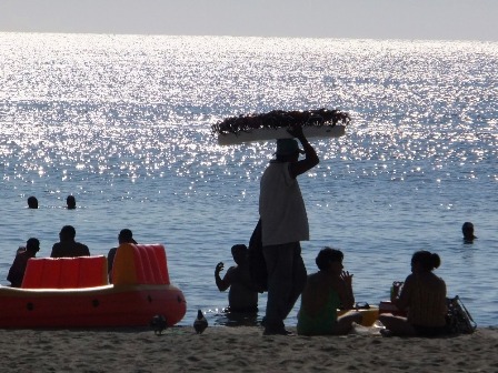 Sunglasses vendor at the beach in El Rodadero, Colombia