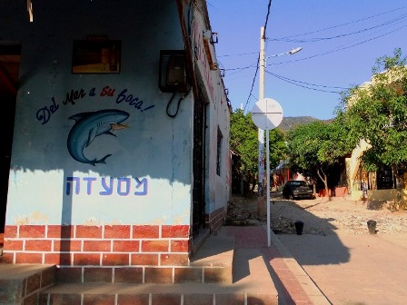 The sign of a restaurant written in Hebrew in Taganga in Colombia