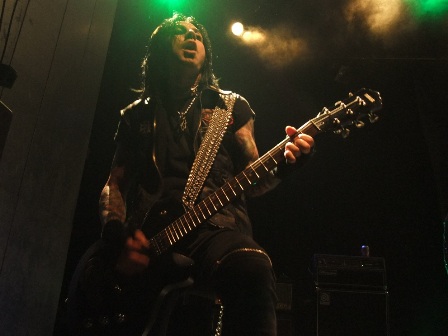 Michael Thomas playing guitar with Faster Pussycat in Paris