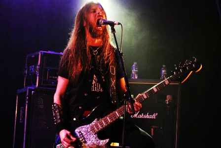 Fox on bass live in Paris with Grand Magus