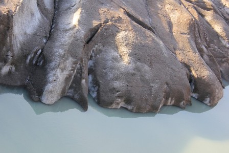 Milky waters and earth over the ice