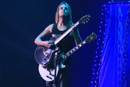 Richie Faulkner playing an Acoustic Guitar during Diamonds And Rust