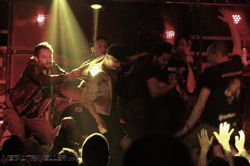 Crowdsurfers on stage with Napalm Death