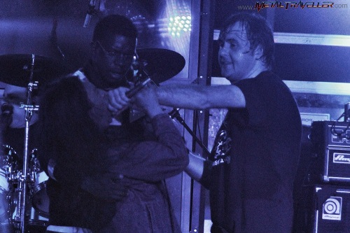 A fan singing with Napalm Death