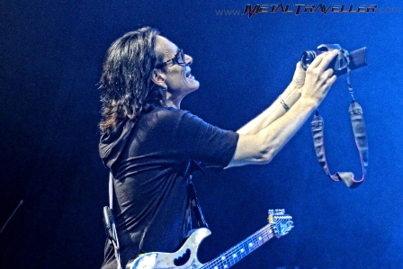 Steve Vai taking a picture of himself on stage