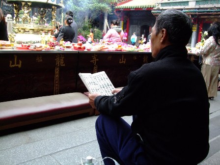 Prayer and meditation at Longshan Temple, Taipei, Taiwan